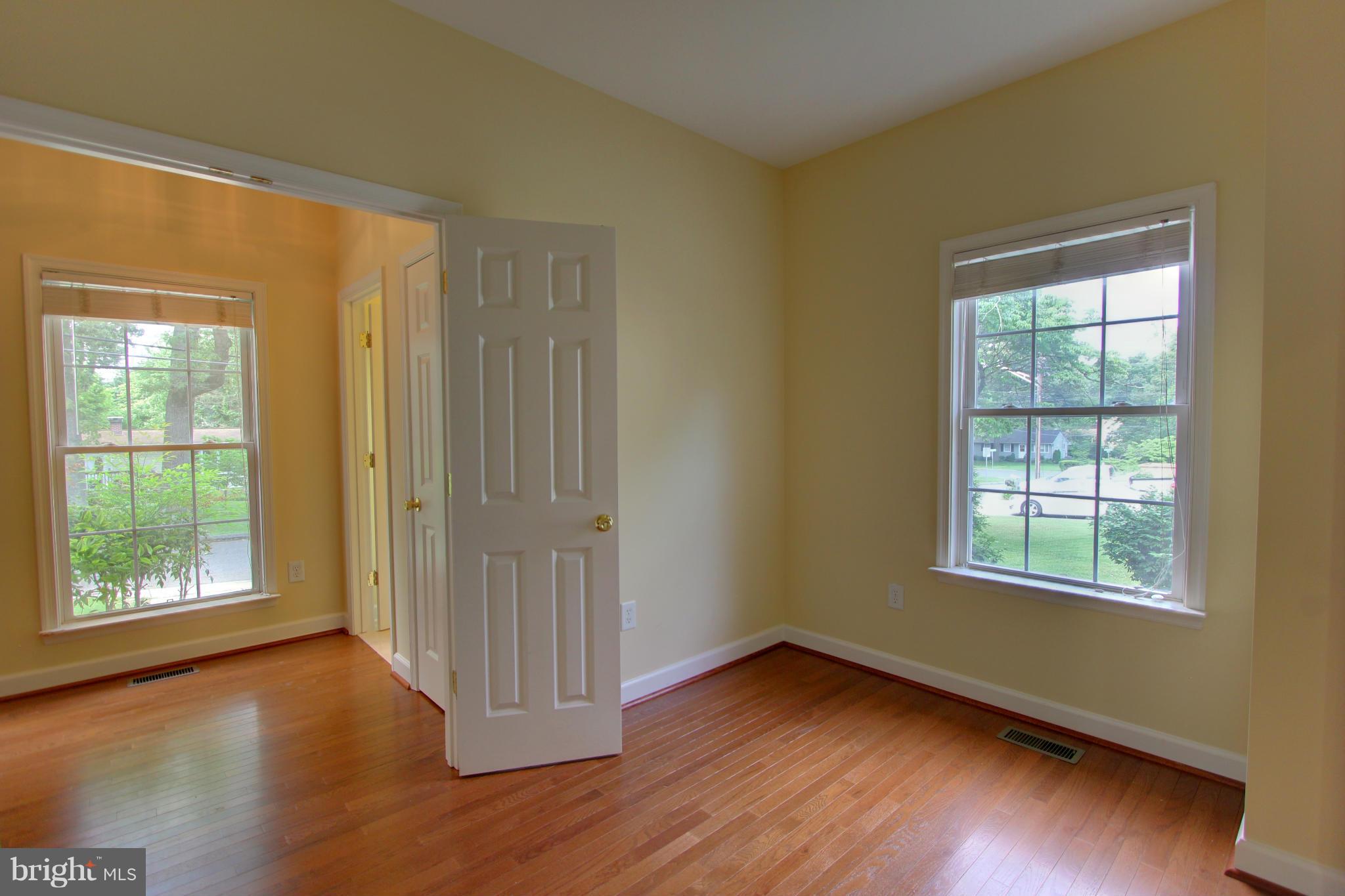 558 Sunset Knoll Road Pasadena, MD 21122 - Photo 15 of 30 a view of a room with wooden floor and windows