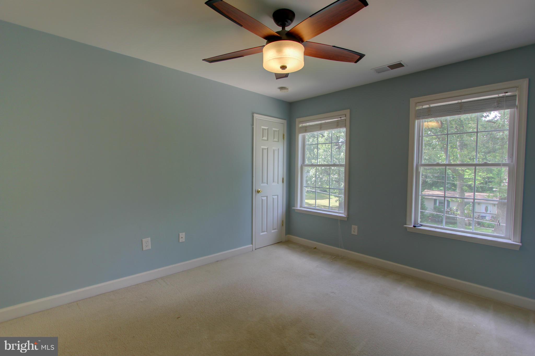 558 Sunset Knoll Road Pasadena, MD 21122 - Photo 17 of 30 a view of an empty room with a window