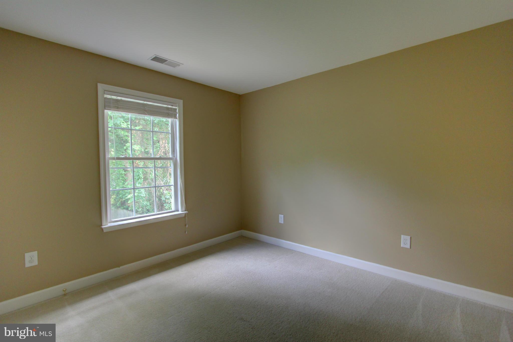 558 Sunset Knoll Road Pasadena, MD 21122 - Photo 26 of 30 an empty room with a empty space and a window