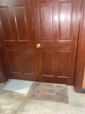 a view of an entryway with wooden wall