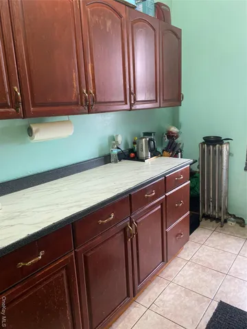 a room with a cabinets and washing machine
