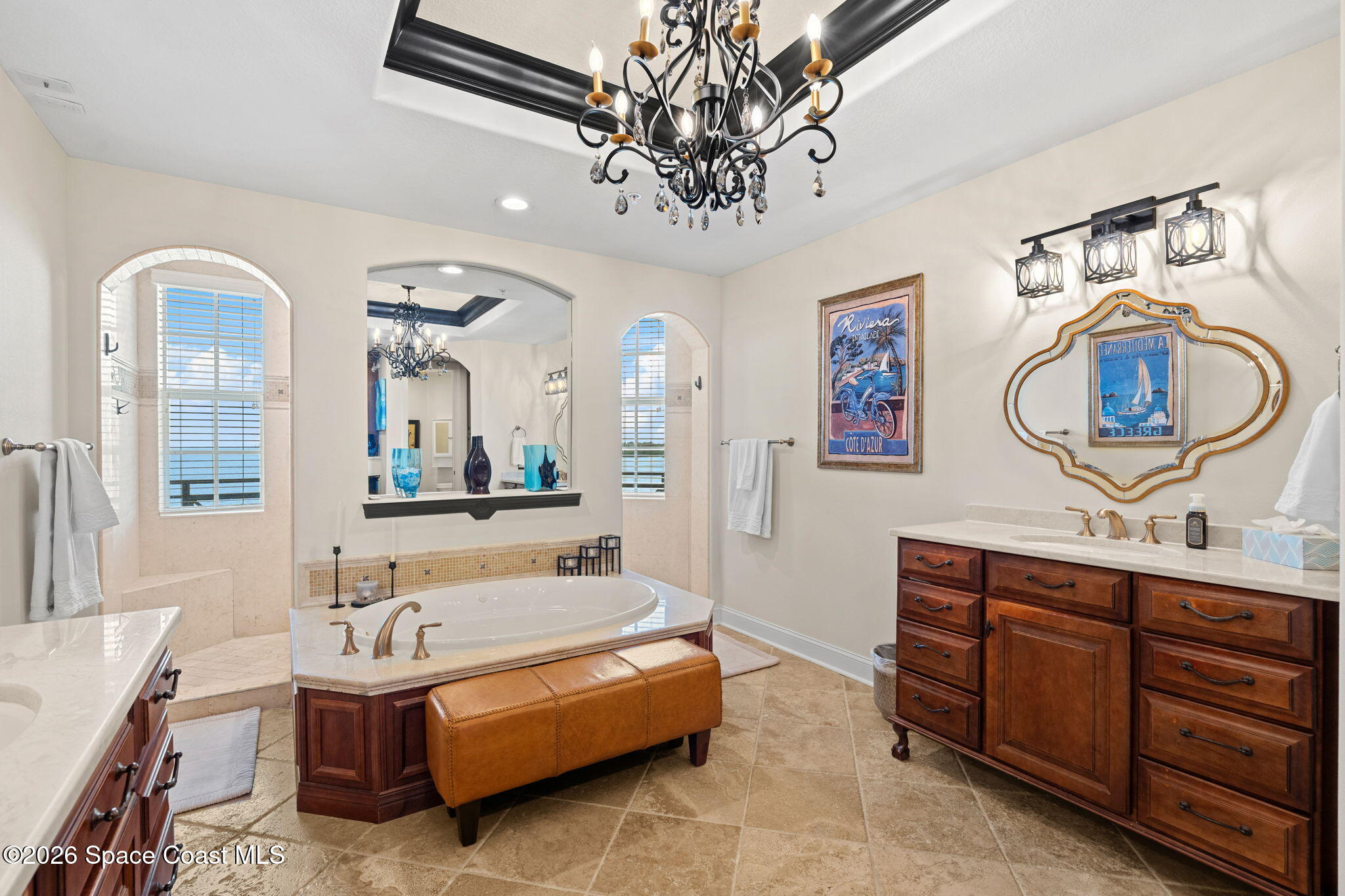 2300 Front Street, Unit 400 Melbourne, FL 32901 - Photo 35 of 78 a bathroom with a tub a double vanity sink a mirror and a window