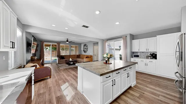 a kitchen with counter top space a sink stove and refrigerator