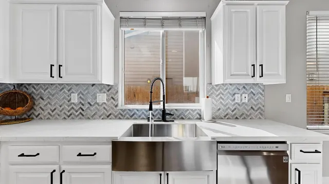 a kitchen with a sink and a cabinets