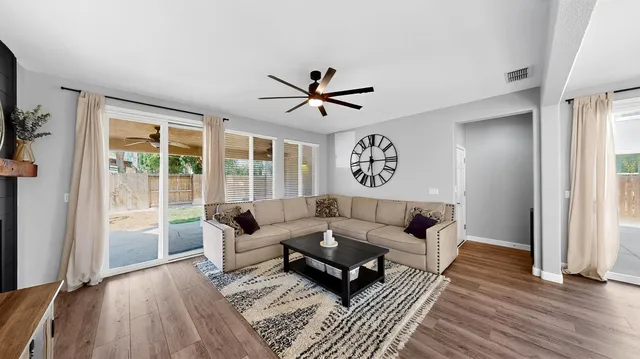 a living room with furniture and a large window
