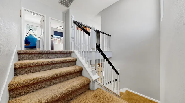 a utility room with sink dryer and washer