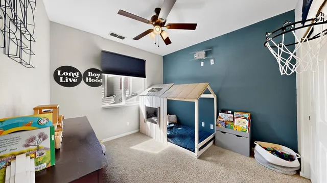 a bedroom with a bed and a couch