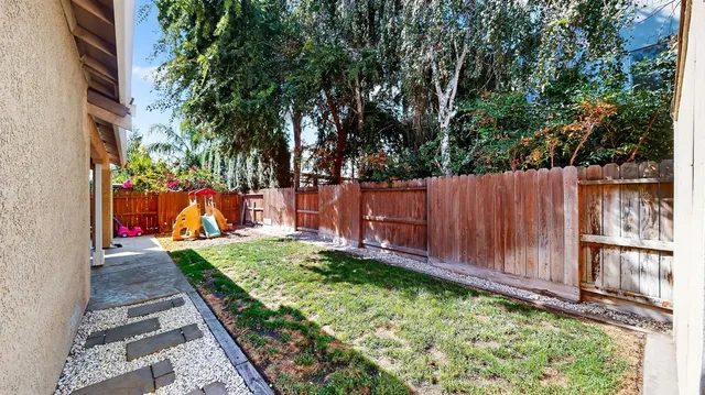 an aerial view of a house with yard swimming pool and outdoor seating