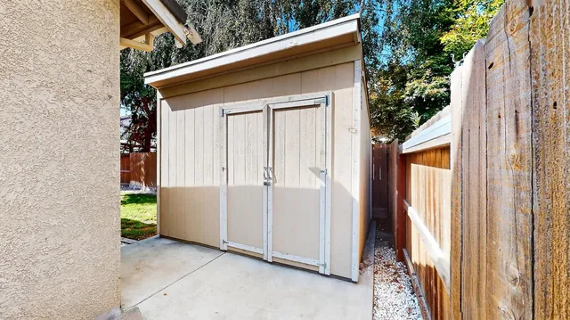 an aerial view of multiple houses with yard
