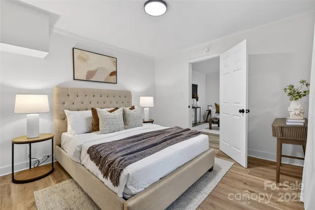 a bed room with a bed and a chair