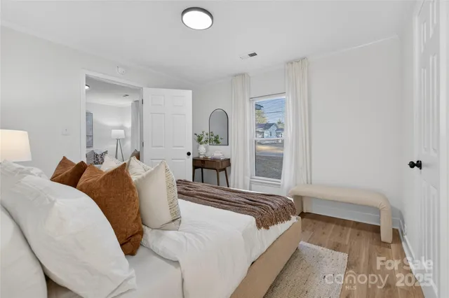 a bed room with a bed and a lamp