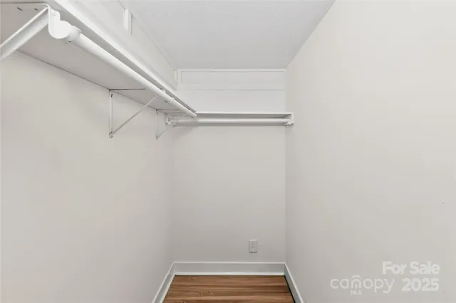 a view of a room with racks on the wall