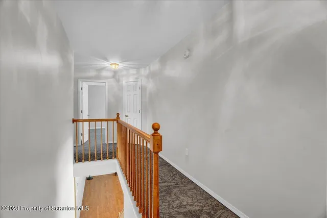 a view of a hallway with entryway