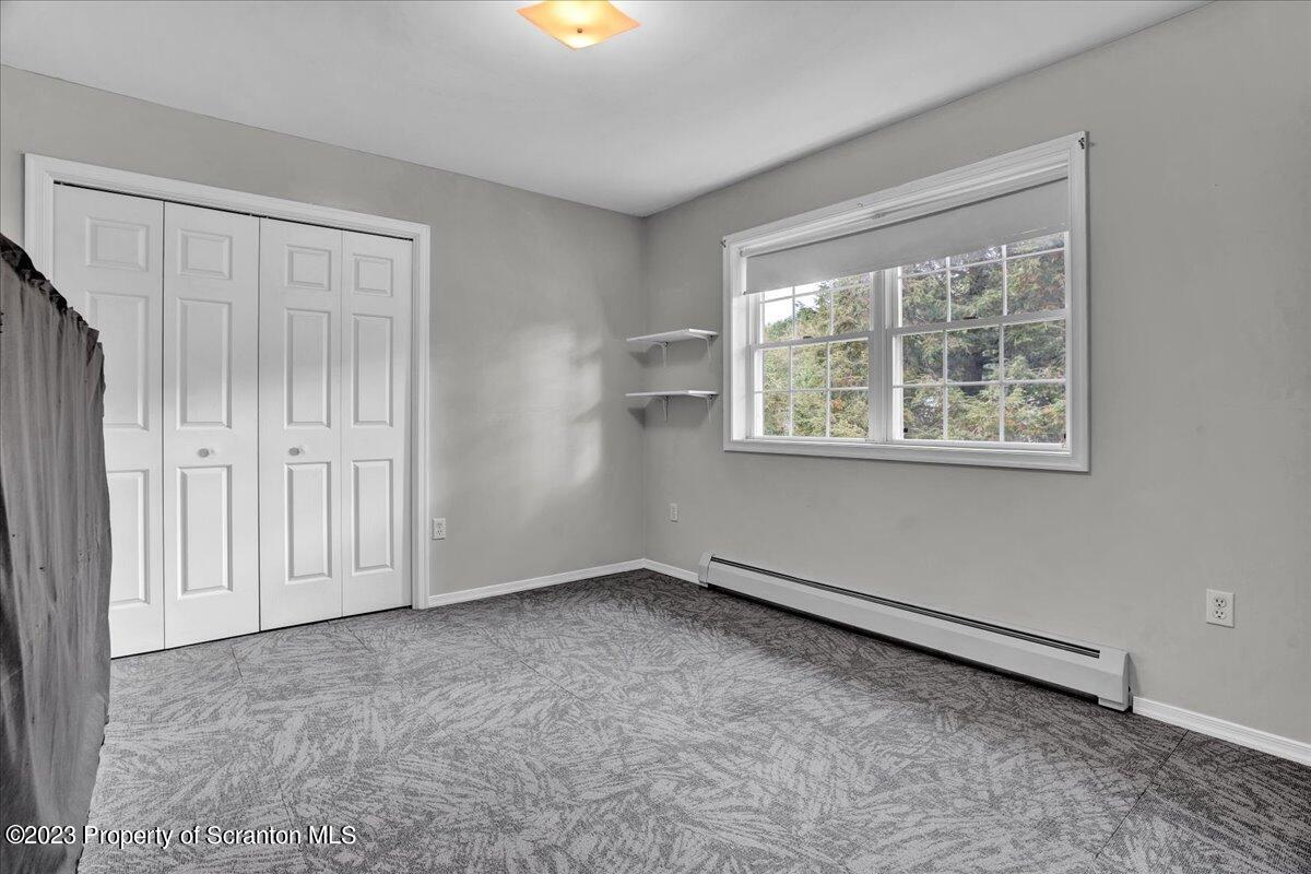 919 Old Logger Road Moscow, PA 18444 - Photo 22 of 36 an empty room with a window