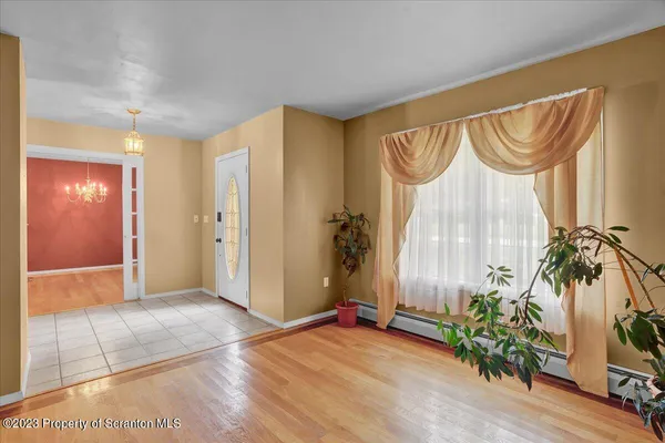 a view of entryway with wooden floor