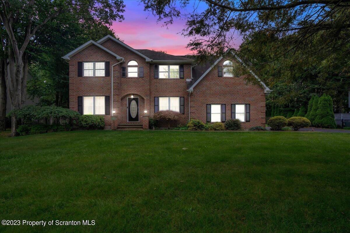 919 Old Logger Road Moscow, PA 18444 - Photo 34 of 36 a front view of a house with a garden
