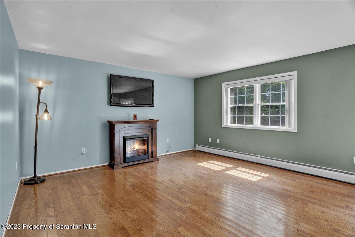 919 Old Logger Road Moscow, PA 18444 - Photo 6 of 36 a view of an empty room with window and fire place