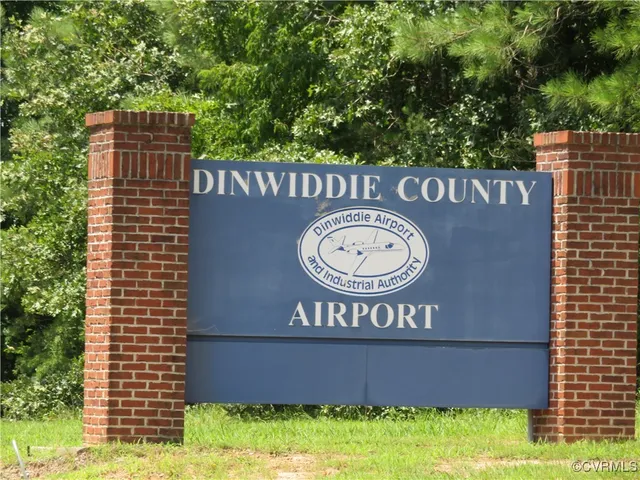 a sign that is on a brick wall