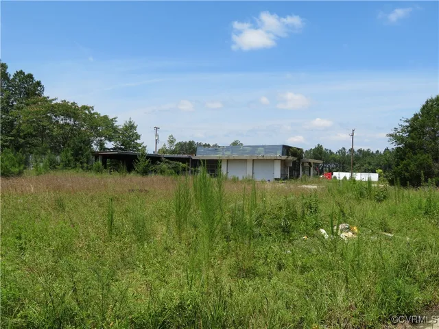a view of a lake with houses in the back