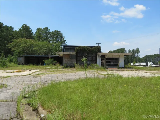 a swimming pool view with a seating space