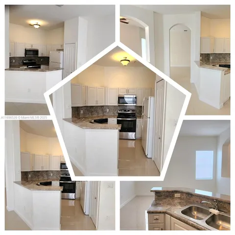 a view of living room with furniture and kitchen view
