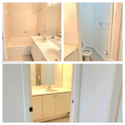 a bathroom with a tub sink and mirror