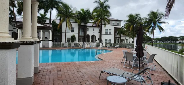 a view of a patio with swimming pool