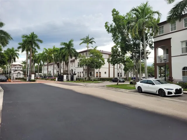 a view of street with parked cars