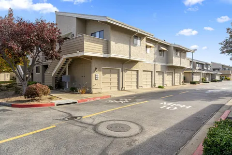 a front view of a house with a basket ball court
