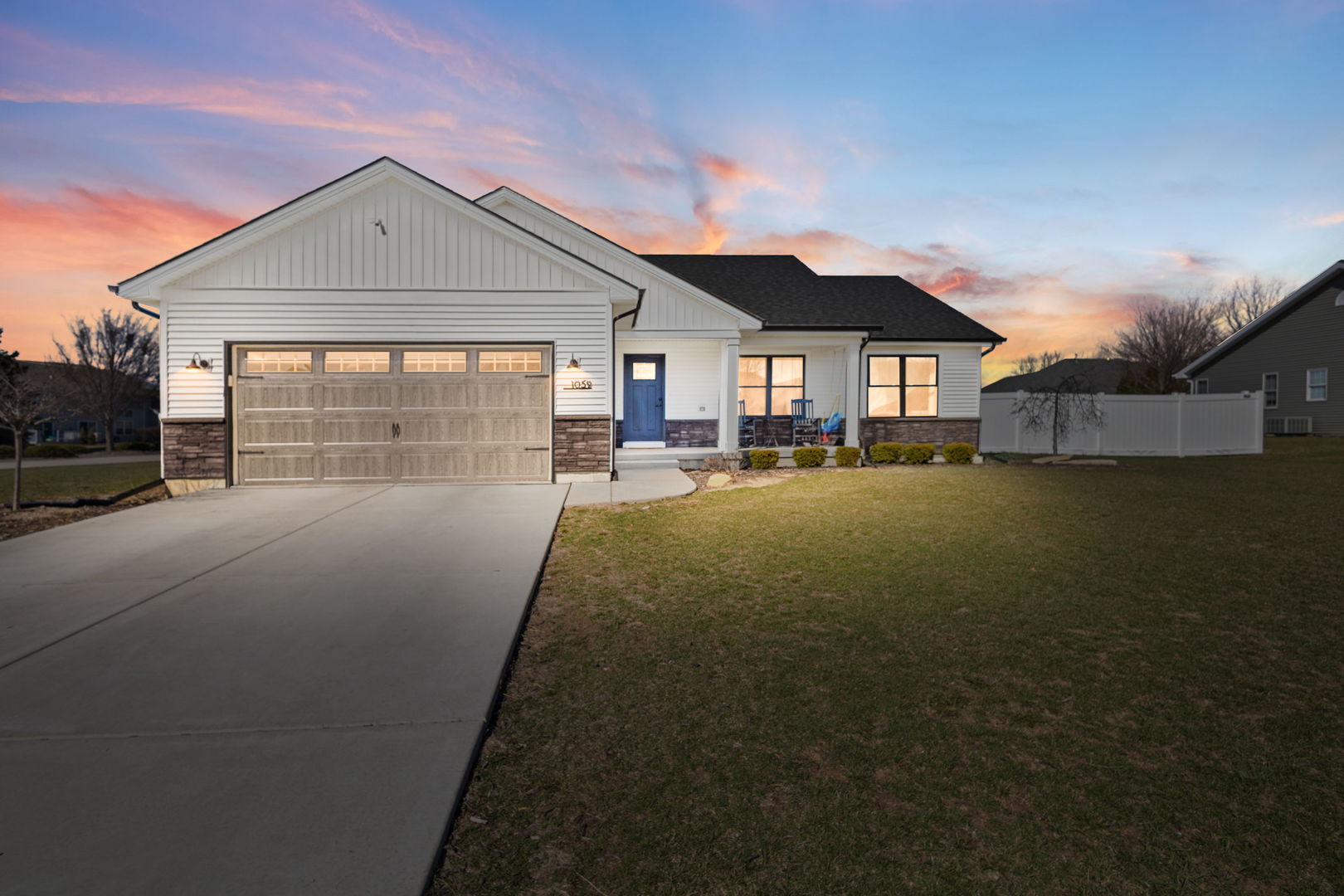 1059 Hummingbird Lane Peotone, IL 60468 - Photo 1 of 30 a front view of a house with a yard and garage