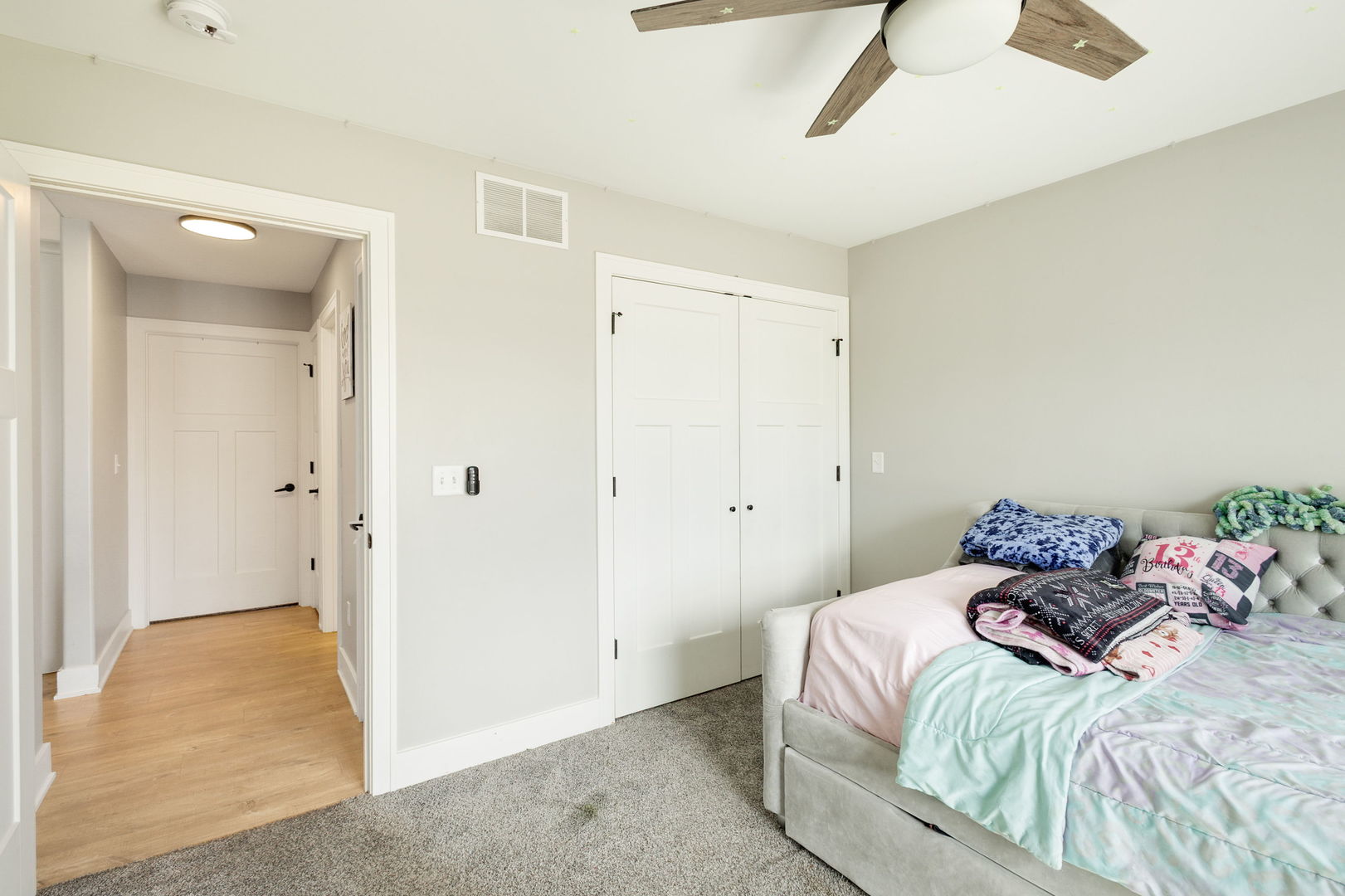 1059 Hummingbird Lane Peotone, IL 60468 - Photo 14 of 30 a bedroom with a bed and hallway