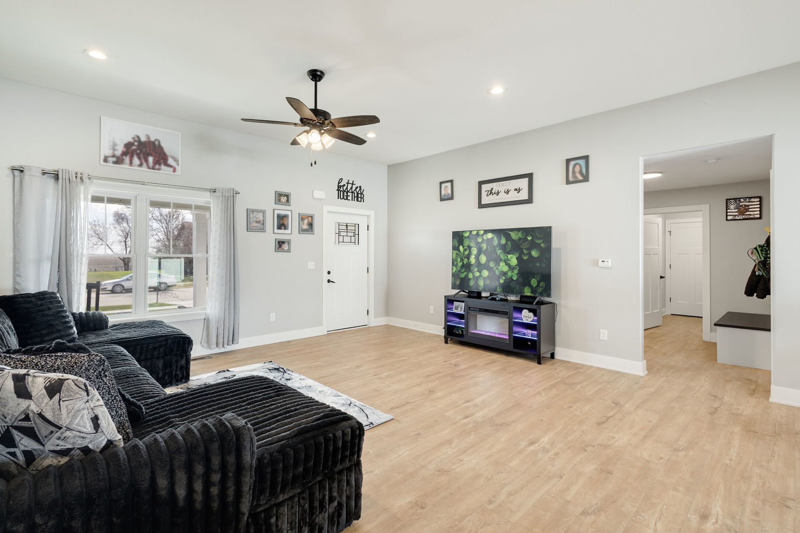 1059 Hummingbird Lane Peotone, IL 60468 - Photo 10 of 30 a living room with furniture and a flat screen tv