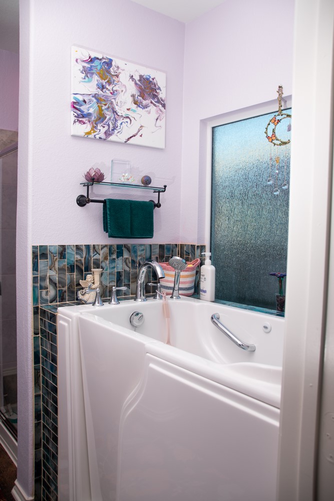 208 Greatest Gift Way Jarrell, TX 76537 - Photo 8 of 16 a bathroom with a sink a mirror and a shower