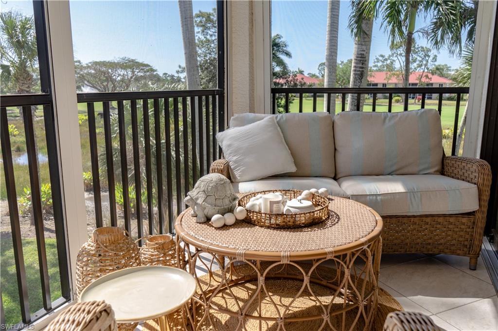265 Deerwood Circle, Unit 10 Naples, FL 34113 - Photo 14 of 38 Balcony featuring outdoor lounge area