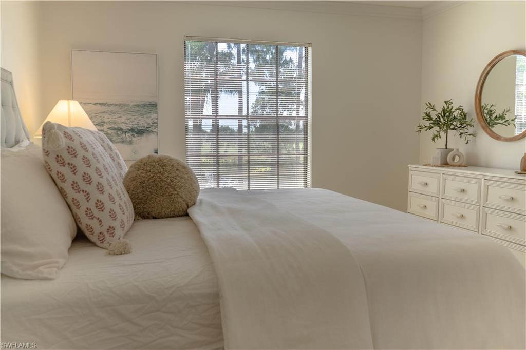 265 Deerwood Circle, Unit 10 Naples, FL 34113 - Photo 31 of 38 Bedroom with ornamental molding