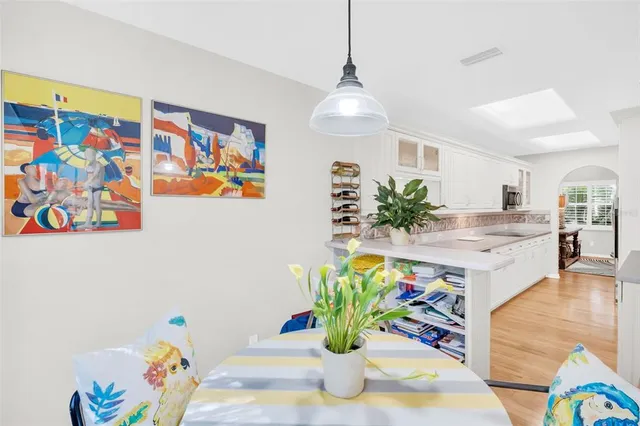 a bathroom with a double vanity sink a mirror and a bathtub