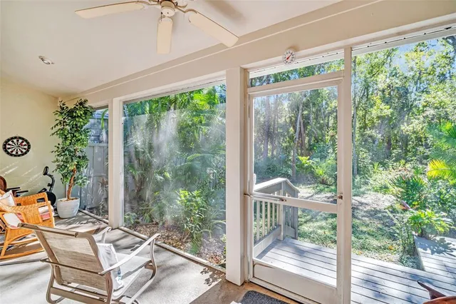 a view of livingroom with furniture workspace and a window