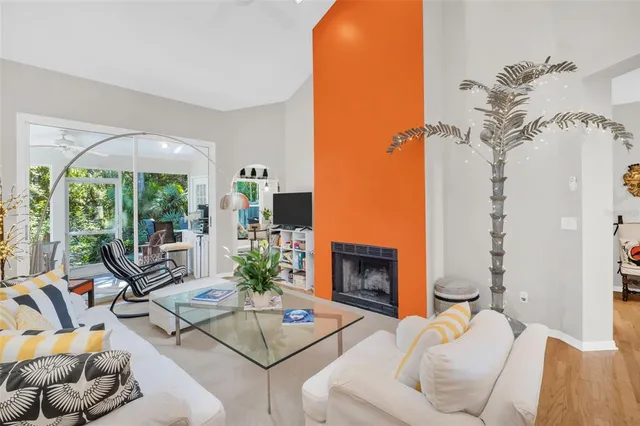 a living room with furniture and white walls
