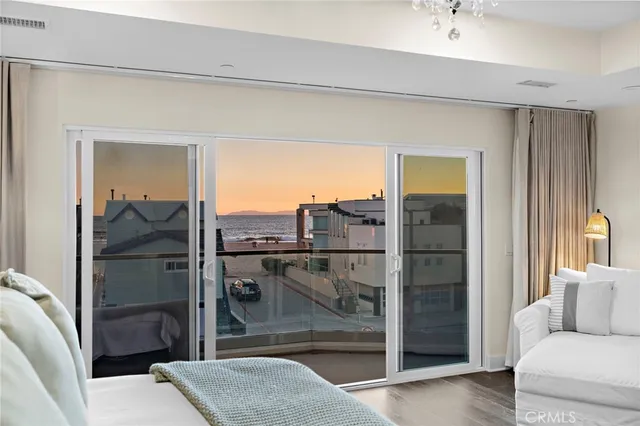 a view of a living room and a balcony