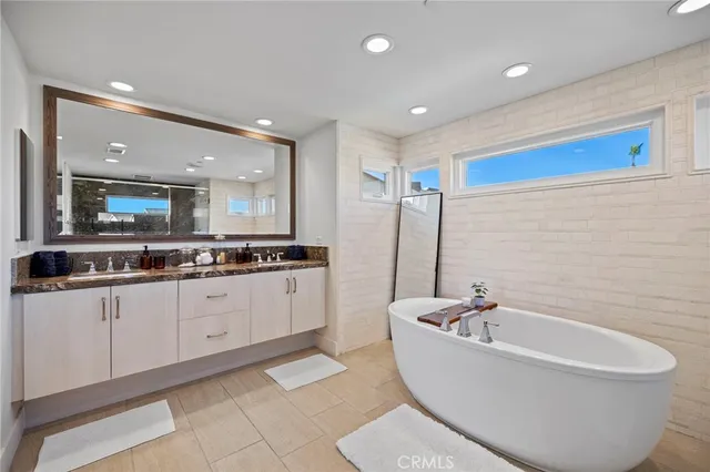a bathroom with a bathtub and a sink