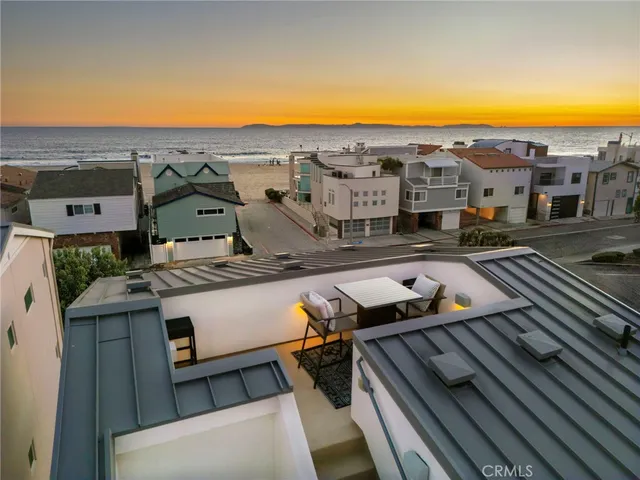 an aerial view of residential houses with an outdoor space