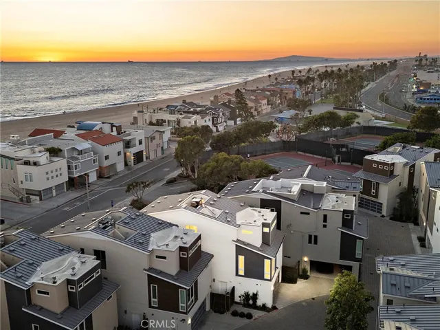 an aerial view of a building with parking