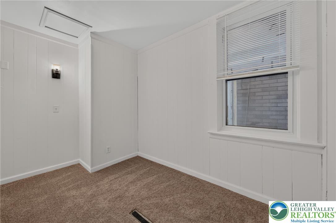 313 Main Street Slatington, PA 18080 - Photo 20 of 73 A versatile room, ready for your personalized touch, features cozy carpeting and natural illumination.