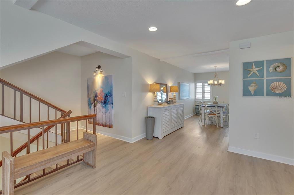 Undisclosed Address Clearwater, FL 33767 - Photo 11 of 39 a view of a living room and dining room