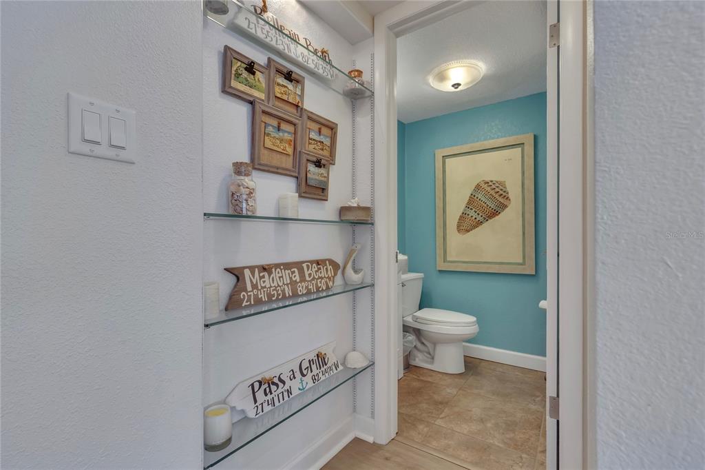 Undisclosed Address Clearwater, FL 33767 - Photo 12 of 39 a bathroom with a toilet and a shower