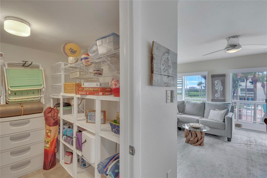 Undisclosed Address Clearwater, FL 33767 - Photo 18 of 39 a living room with furniture cabinets and a window
