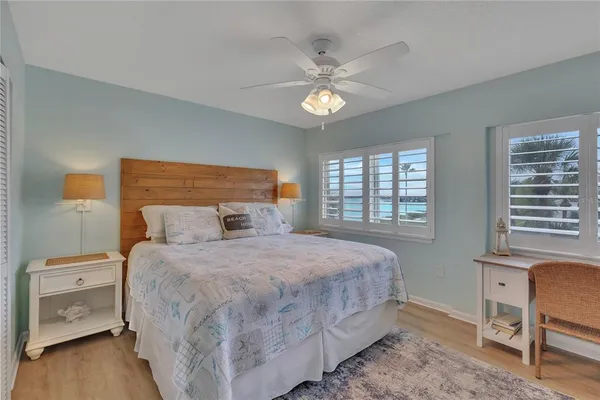 a bedroom with a large bed and a window