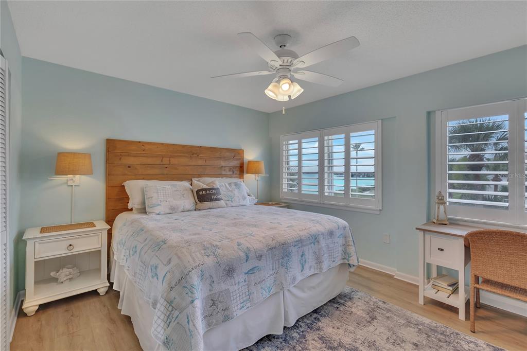 Undisclosed Address Clearwater, FL 33767 - Photo 31 of 39 a bedroom with a large bed and a window