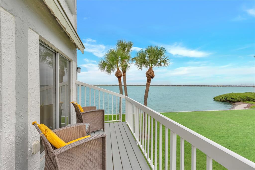 Undisclosed Address Clearwater, FL 33767 - Photo 39 of 39 a view of a balcony with lake view and a floor to ceiling window