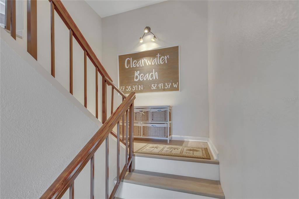 Undisclosed Address Clearwater, FL 33767 - Photo 6 of 39 a view of staircase with railing and white walls